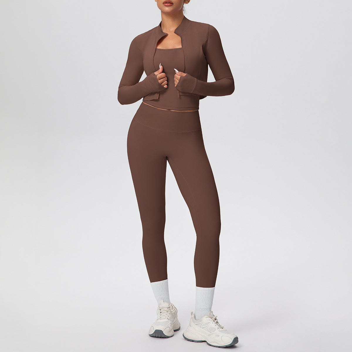 Solid color zipper long - sleeve jacket, racerback tank top, and slim - fit yoga pants, a three - piece yoga/fitness set
