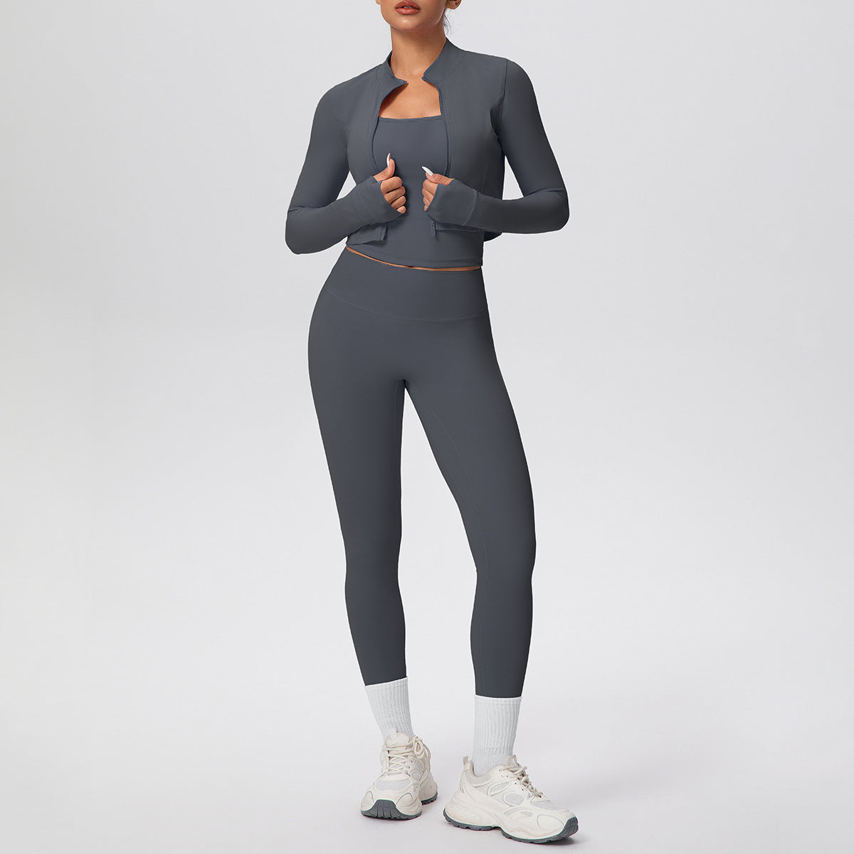 Solid color zipper long - sleeve jacket, racerback tank top, and slim - fit yoga pants, a three - piece yoga/fitness set