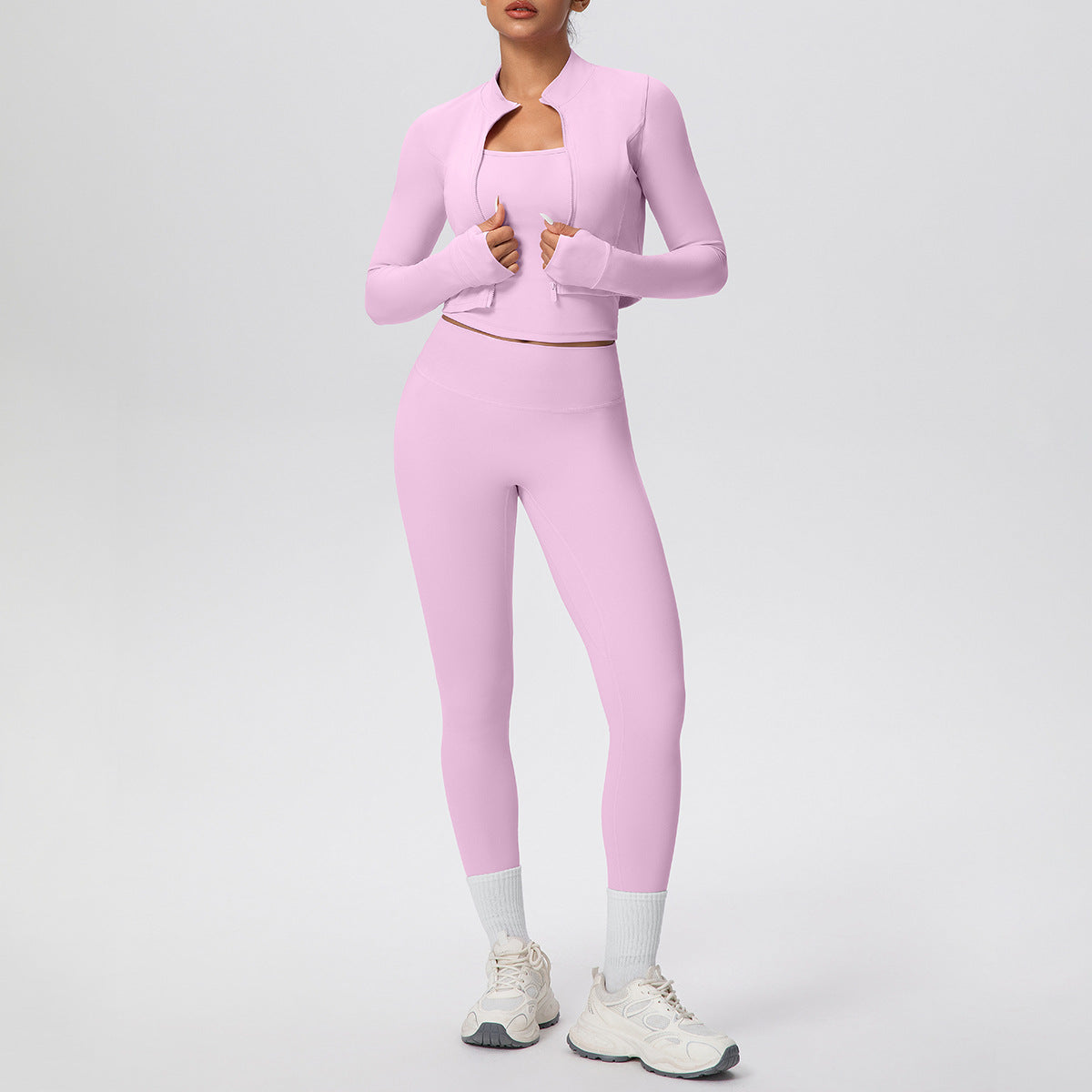 Solid color zipper long - sleeve jacket, racerback tank top, and slim - fit yoga pants, a three - piece yoga/fitness set