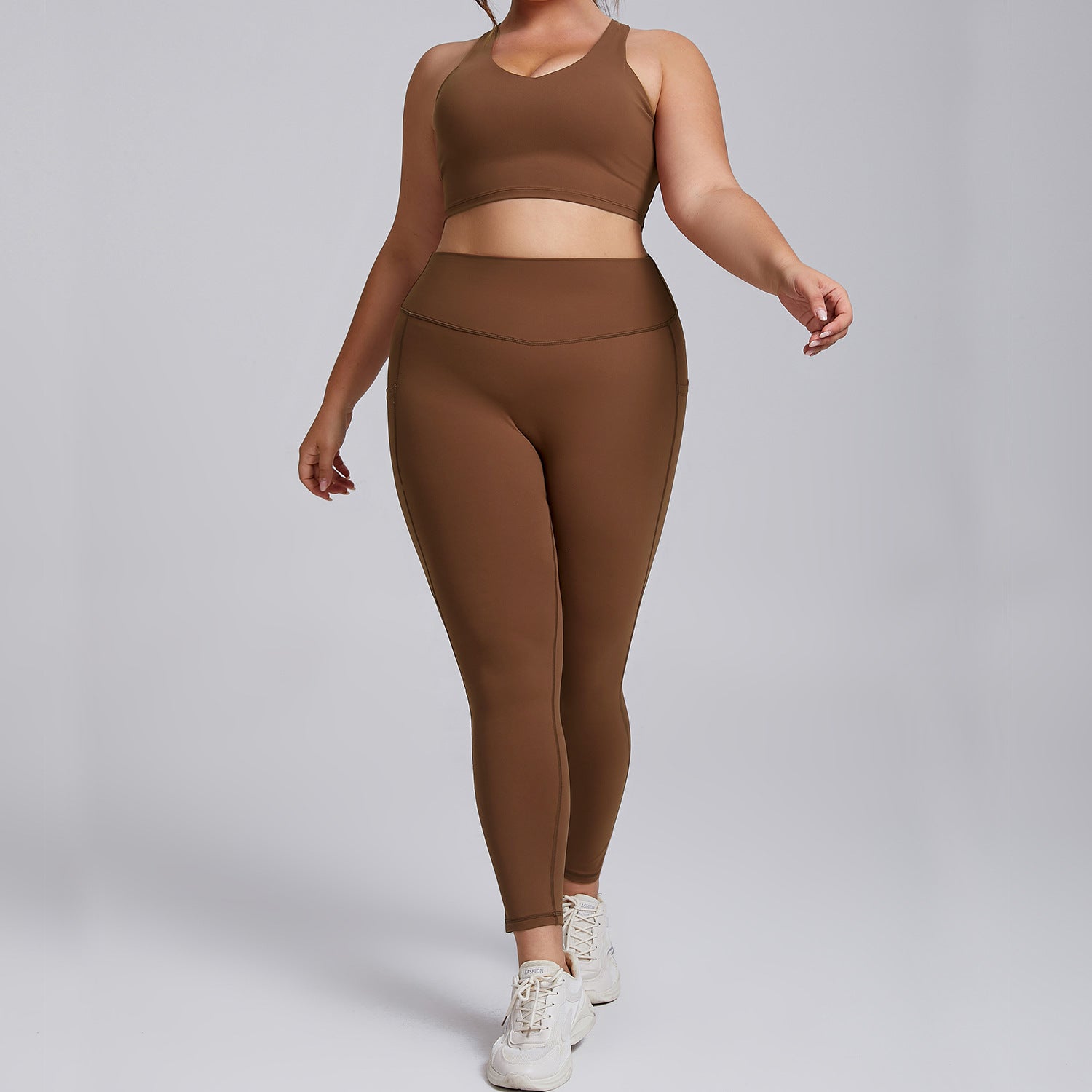 Plus-size women's activewear nude shampooed high-waisted yoga suit